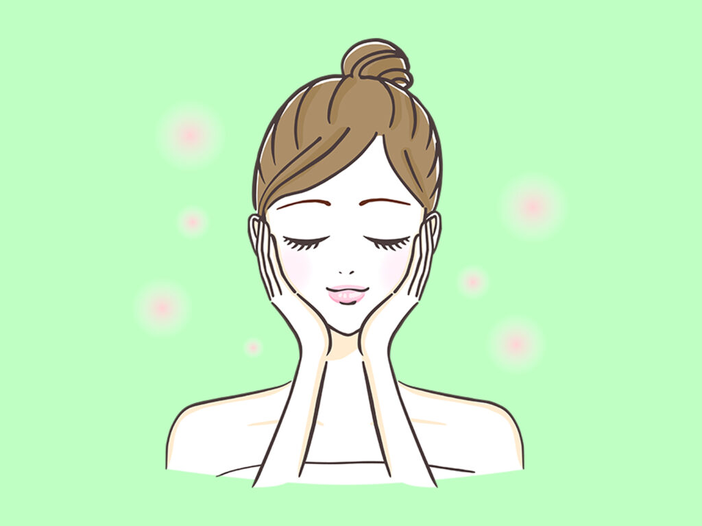 顔のパッティングをしている女性